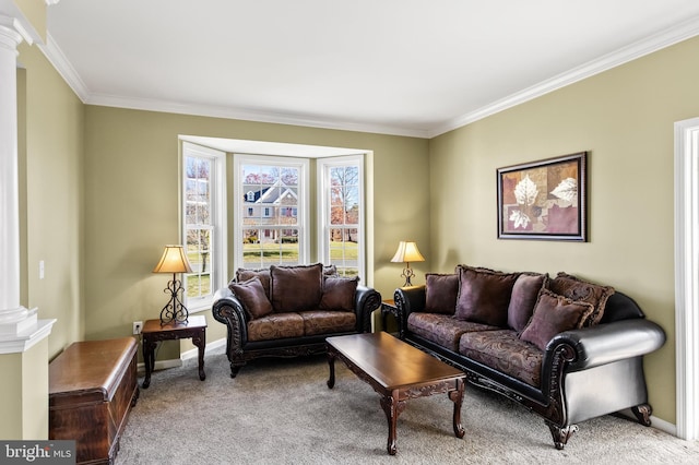 living room with carpet flooring, ornate columns, and ornamental molding