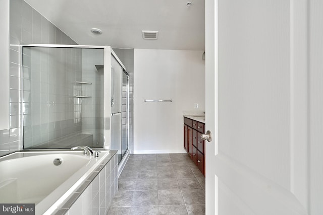 bathroom with vanity, tile patterned floors, and independent shower and bath