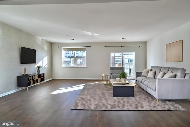 living room featuring dark hardwood / wood-style flooring