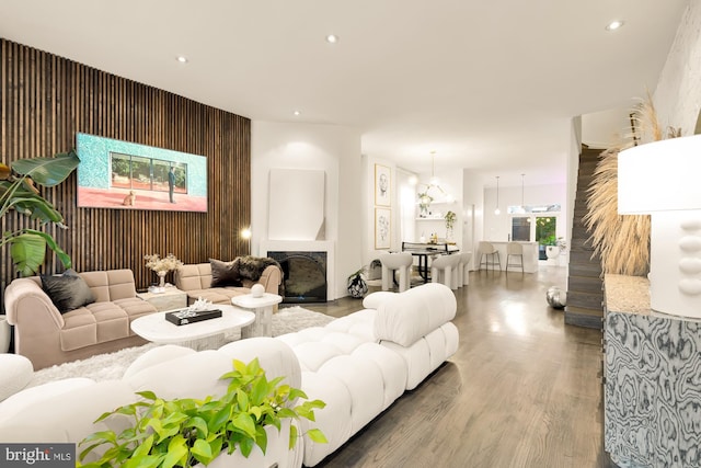 living room featuring wood-type flooring and a fireplace