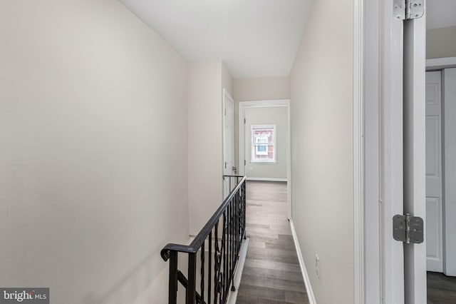 hallway with dark hardwood / wood-style flooring