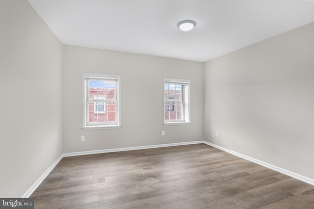 spare room with hardwood / wood-style flooring