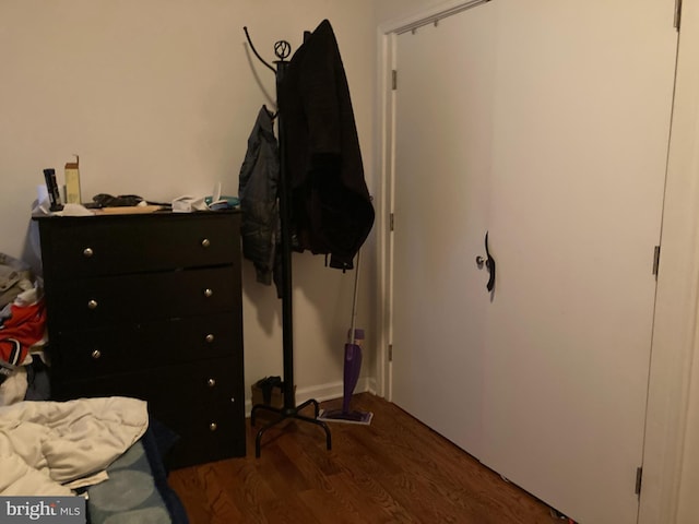 bedroom featuring dark hardwood / wood-style flooring