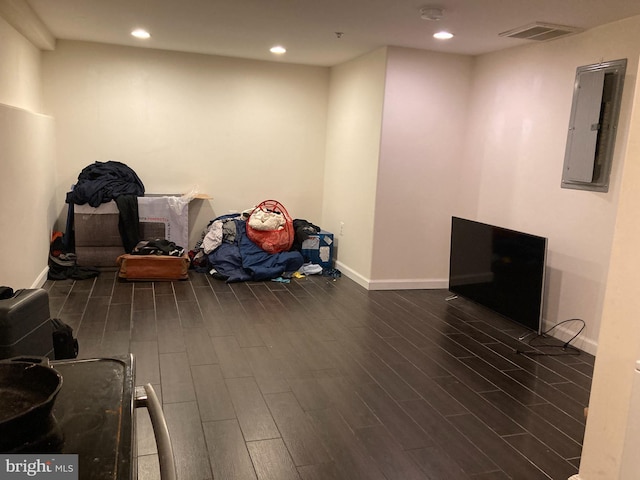 interior space with electric panel and dark hardwood / wood-style floors