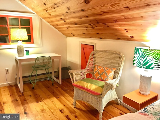 sitting room featuring baseboard heating, light wood-type flooring, lofted ceiling, wood ceiling, and ornamental molding