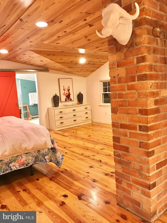 bedroom featuring a barn door, wood ceiling, and light hardwood / wood-style flooring