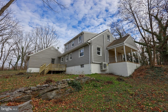 rear view of house with ac unit