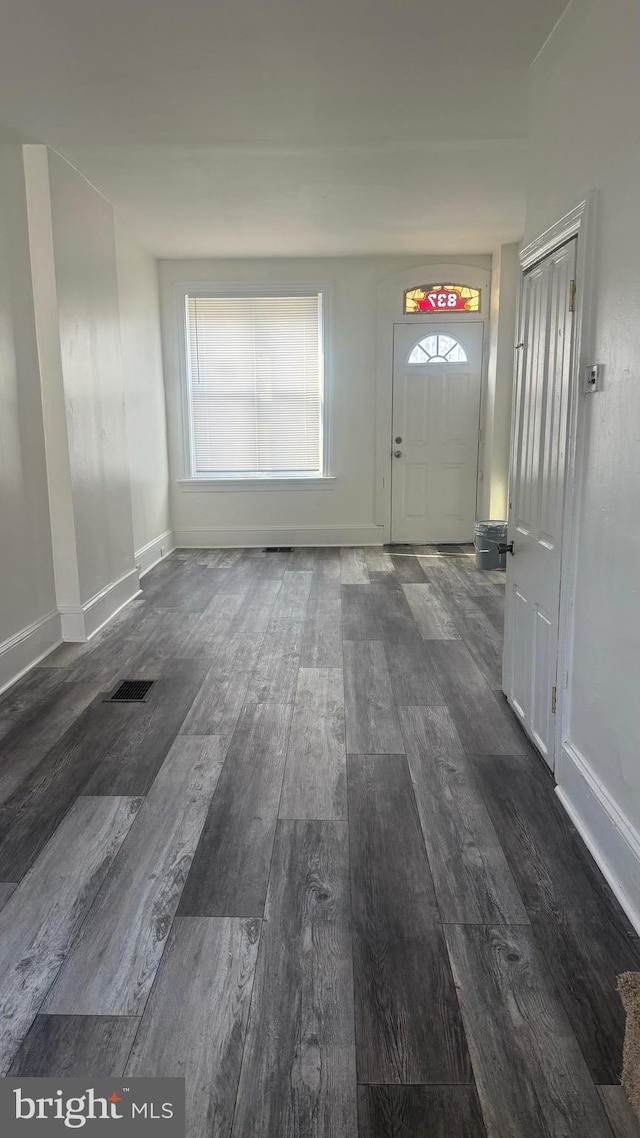 entrance foyer with dark hardwood / wood-style floors