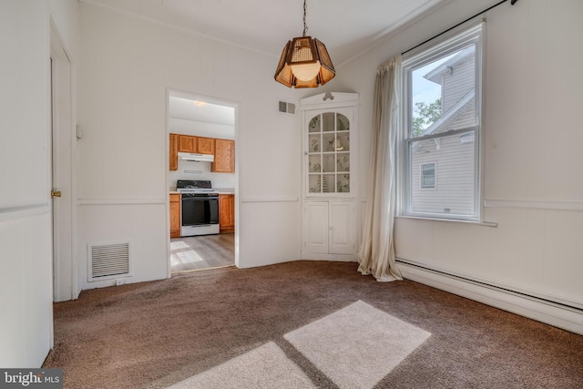 unfurnished dining area with carpet floors and a baseboard heating unit