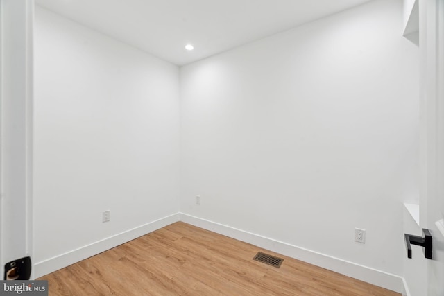 spare room featuring hardwood / wood-style flooring