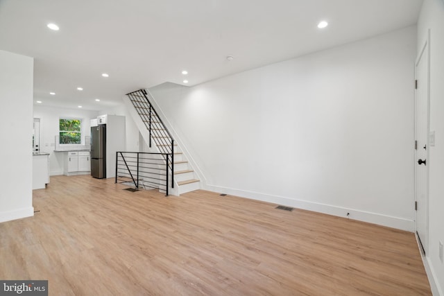 unfurnished room featuring light wood-type flooring