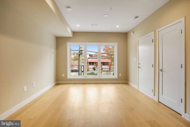 empty room with light wood-type flooring