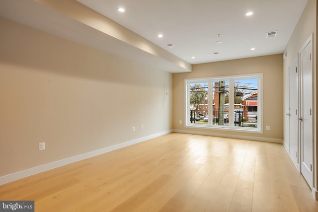 empty room with light wood-type flooring