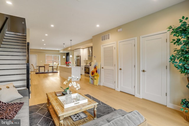 living room featuring light wood-type flooring