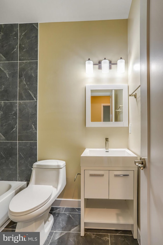 bathroom featuring vanity and toilet