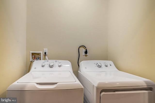 laundry room with independent washer and dryer