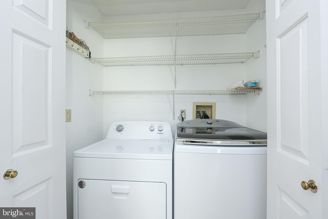 washroom featuring washer and dryer