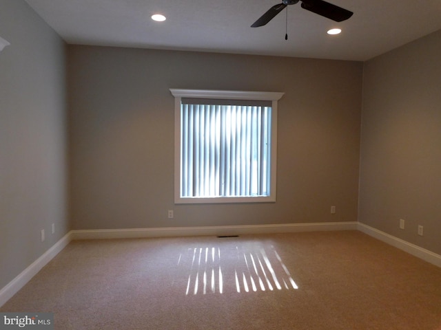 carpeted empty room with ceiling fan