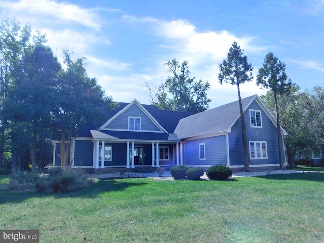 view of front facade featuring a front yard and a porch