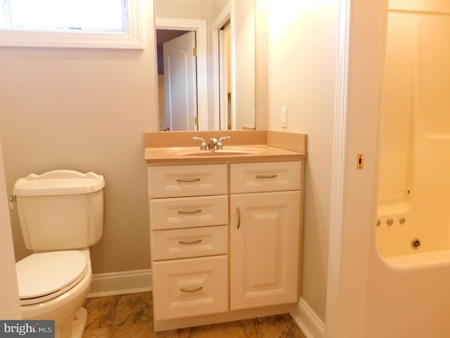 bathroom with vanity and toilet