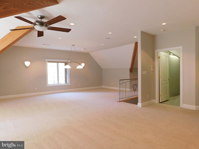 additional living space featuring lofted ceiling, light colored carpet, and ceiling fan with notable chandelier