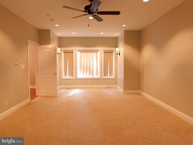 carpeted empty room with ceiling fan