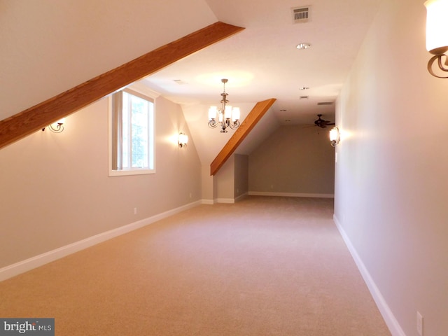 bonus room with carpet flooring, vaulted ceiling, and ceiling fan with notable chandelier