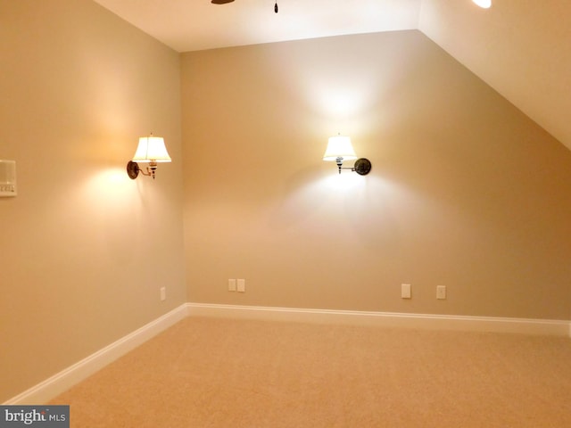 interior space featuring carpet floors, ceiling fan, and vaulted ceiling