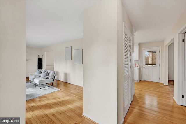 hallway featuring light hardwood / wood-style flooring