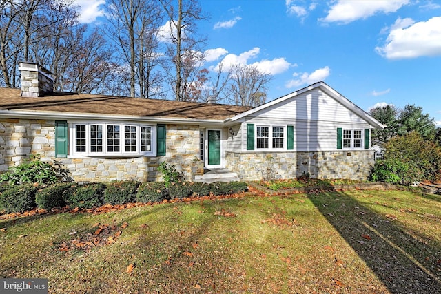 ranch-style house with a front lawn