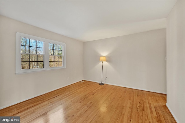 empty room with light hardwood / wood-style floors