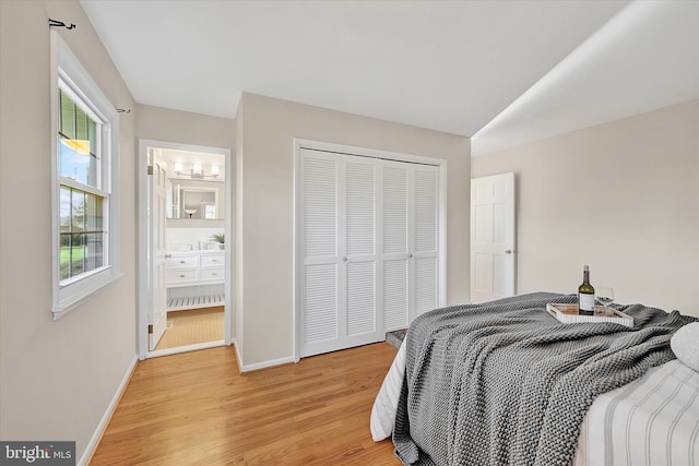 bedroom featuring a closet and light hardwood / wood-style flooring