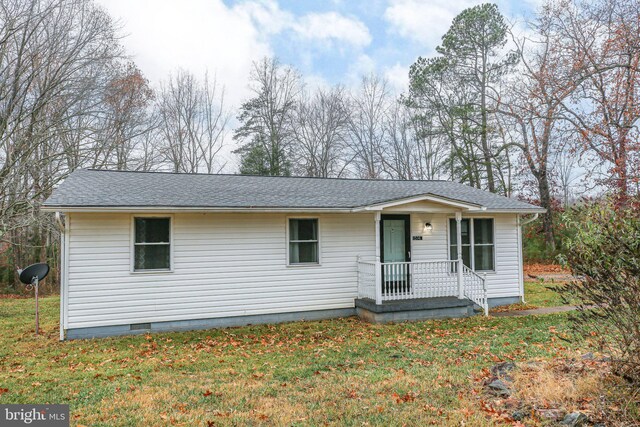 ranch-style home with a front lawn