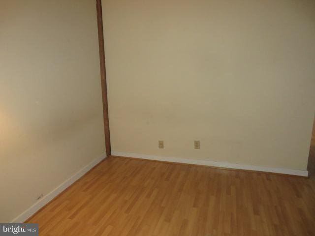 unfurnished room with light hardwood / wood-style floors