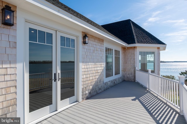 deck featuring french doors and a water view