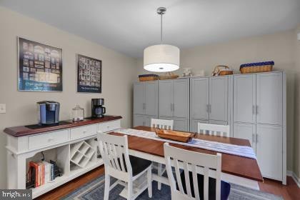 dining room with dark hardwood / wood-style flooring