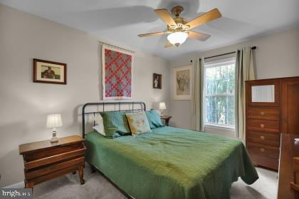 carpeted bedroom featuring ceiling fan