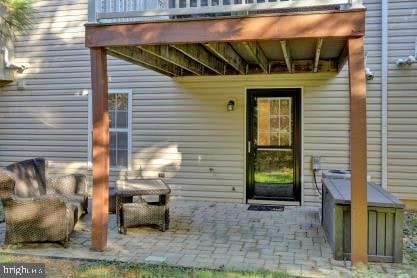 entrance to property with a patio area