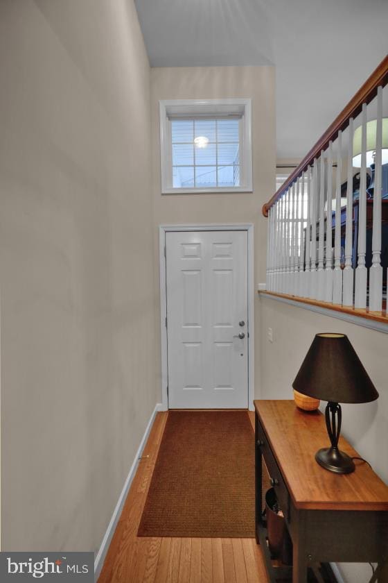 doorway to outside with hardwood / wood-style flooring