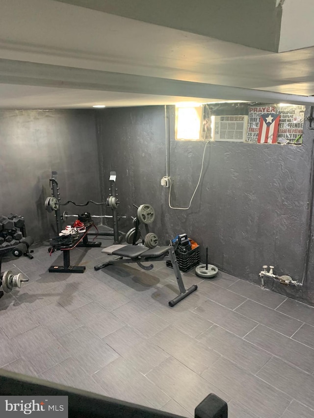 exercise room with a wall mounted air conditioner