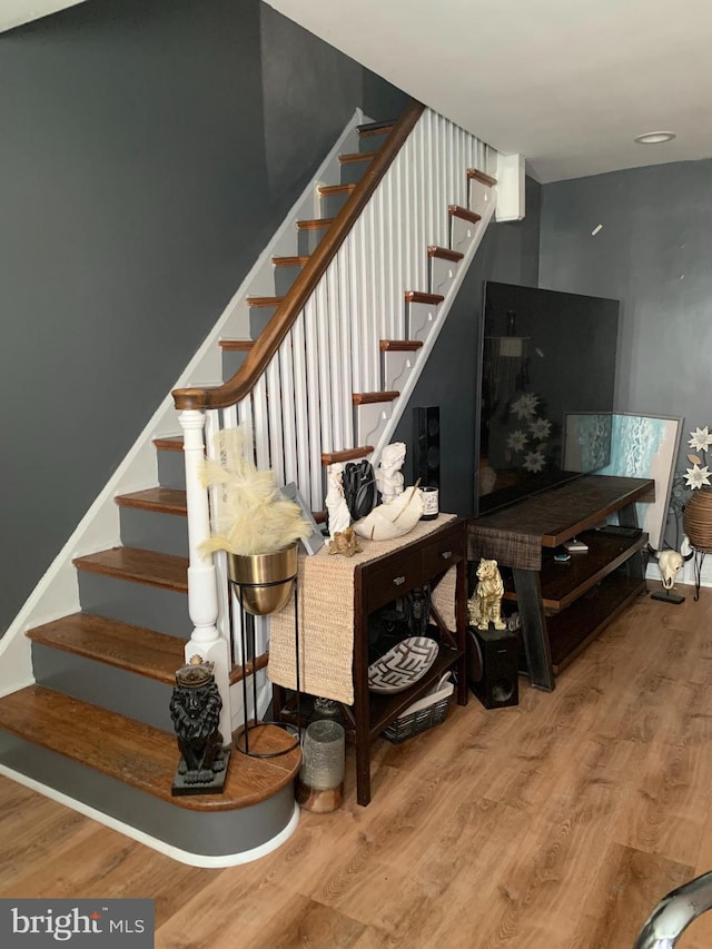 stairway featuring hardwood / wood-style floors