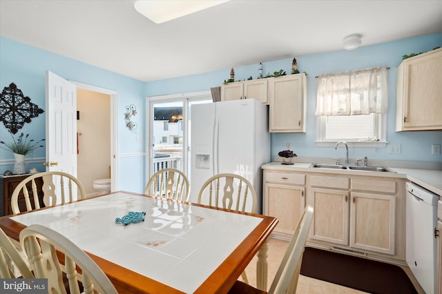 tiled dining room with sink