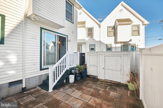 doorway to property with a patio