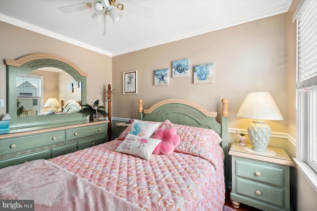 bedroom with ceiling fan and crown molding