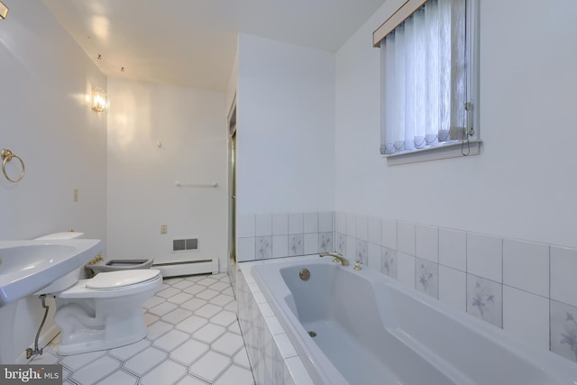 bathroom featuring baseboard heating, a relaxing tiled tub, and toilet