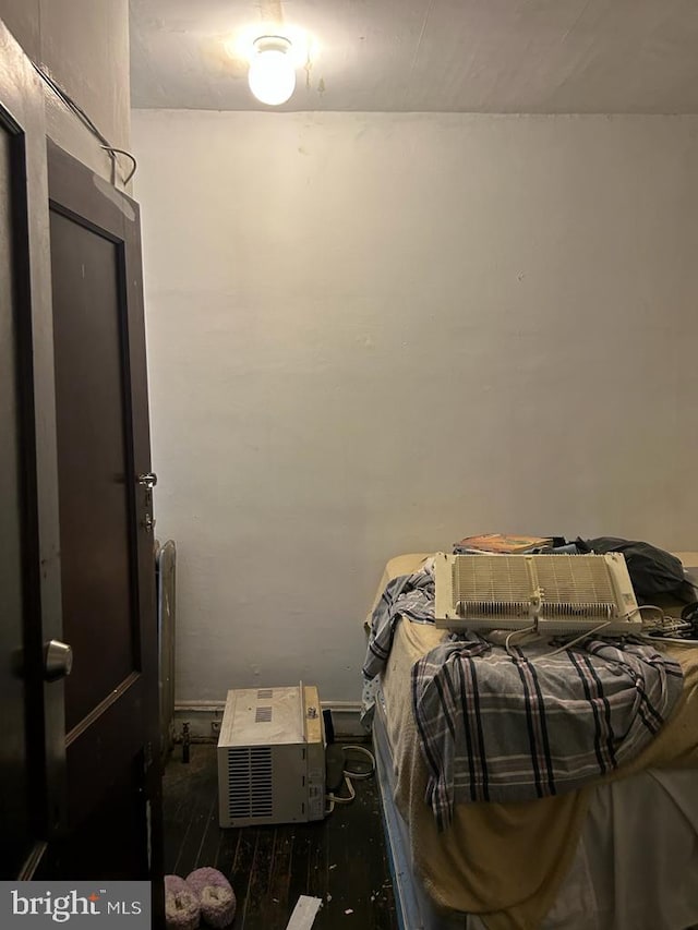 bedroom featuring dark hardwood / wood-style flooring