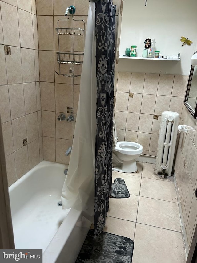 bathroom featuring radiator, tile walls, toilet, shower / tub combo with curtain, and tile patterned flooring