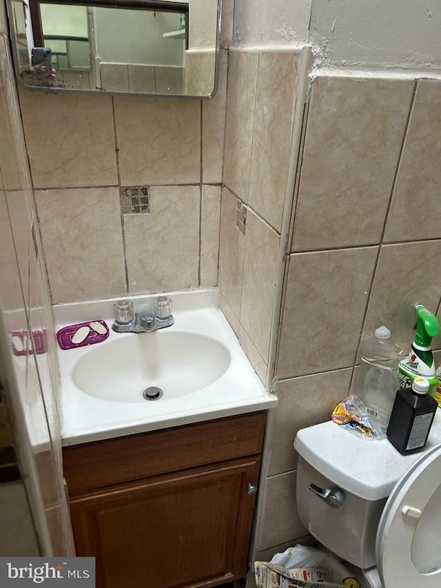 bathroom with vanity and toilet