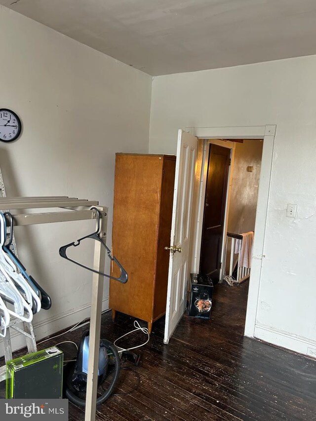 workout area featuring dark hardwood / wood-style flooring