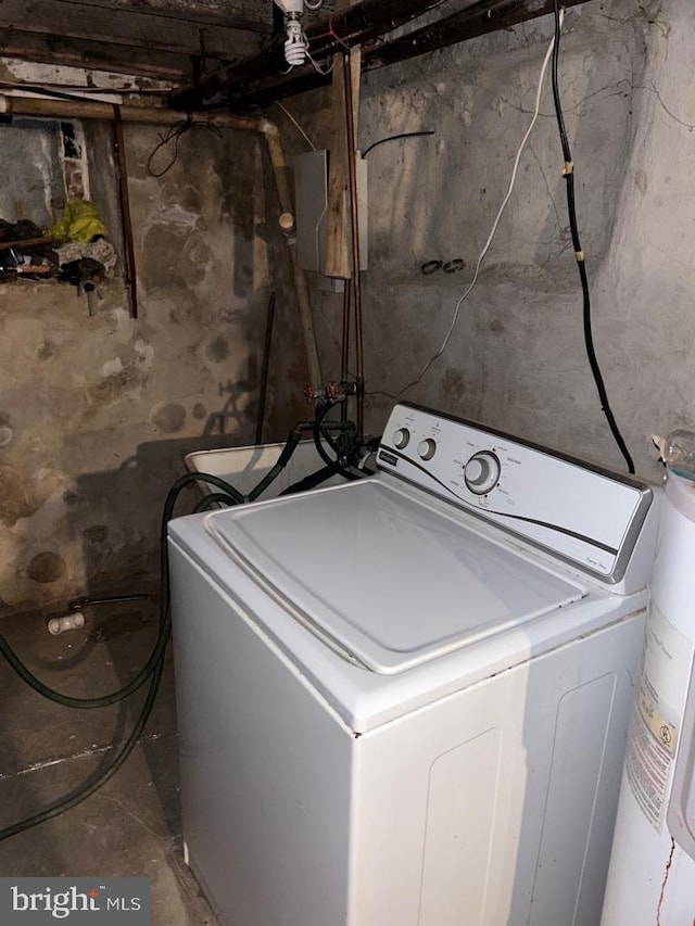 laundry room featuring washer / dryer and water heater